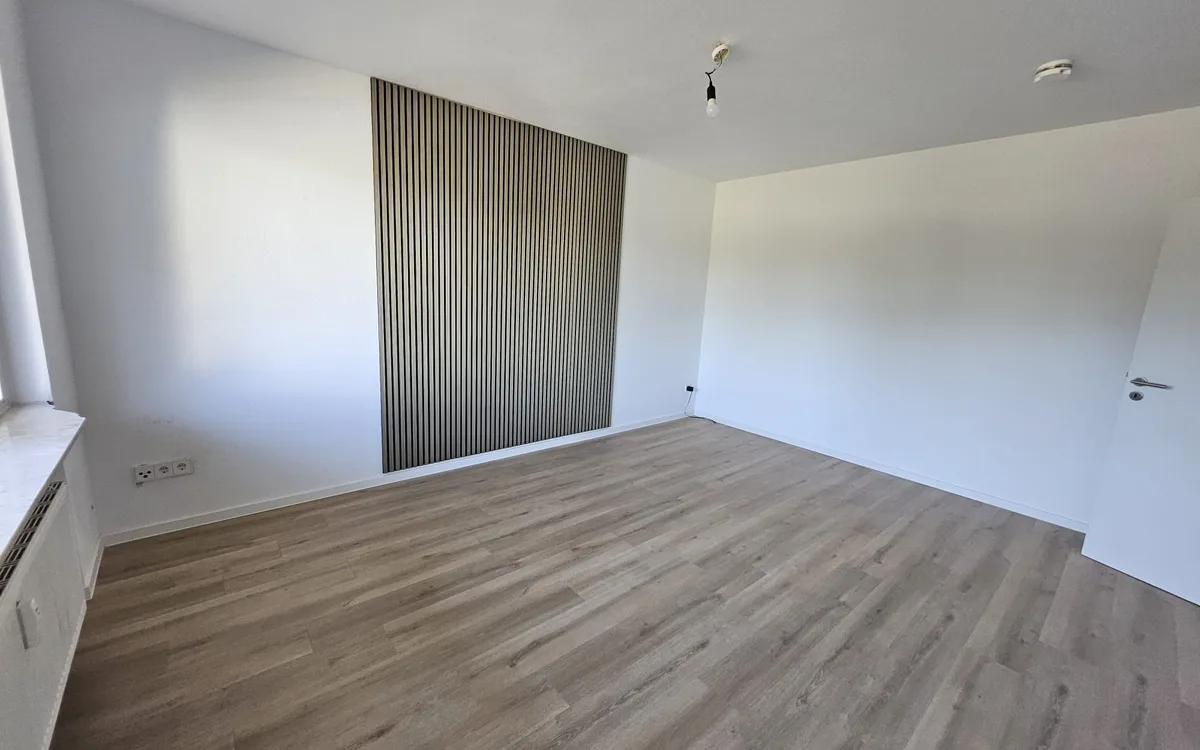 Refurbished 2-room apartment with acoustic wood wall in Hanau
